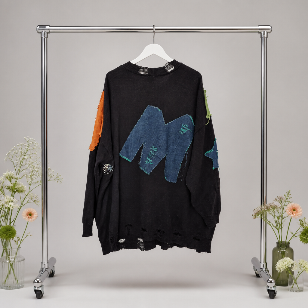 Lössiger Strickpulli mit coolen Extras
